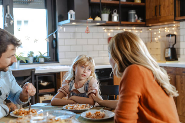 istock Parents talk to a child who refuses to eat lunch 2148758801