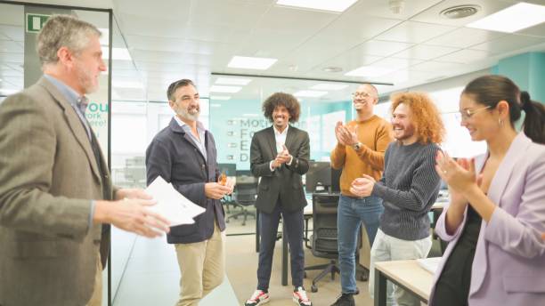 istock Team clapping for a successful presentation in a contemporary office. 2148759530