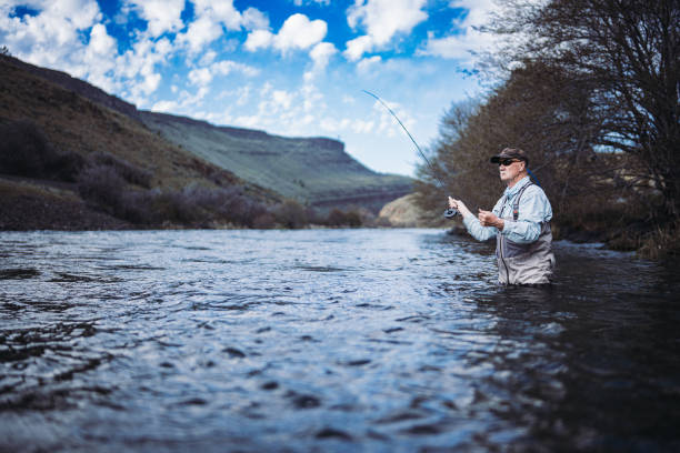 istock Active senior man fly fishing in Oregon 2148761524