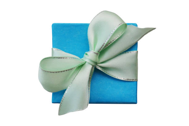 A beautiful wrapped gift box in a soft blue color, tied with a delicate ribbon, perfect for any occasion.