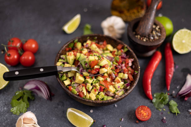 istock traditional salsa dip snack in wooden bowl on a table with ingredients 2148765512