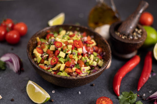 istock traditional salsa dip snack in wooden bowl on a table with ingredients 2148765520