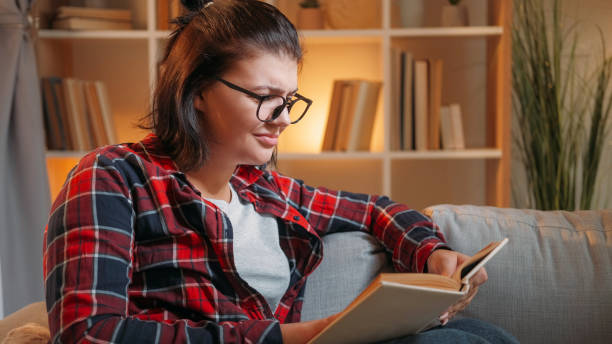 istock Evening reading book leisure knowledge woman 2148765659