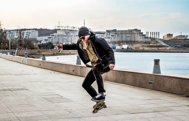 istock Young man riding a skateboard making tricks and jumps 2148766746