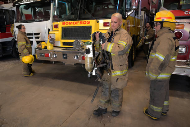 istock female firefighter preparing her equipment 2148768348