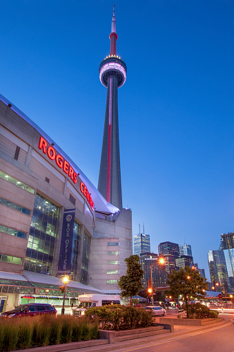 Rogers Centre with CN Tower and Toronto financial core buildings at night