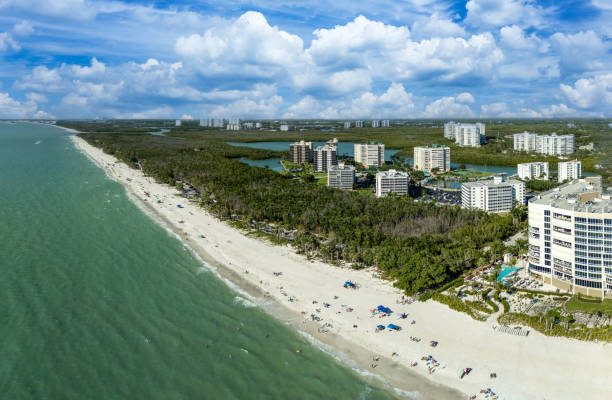 istock Blue sky over the beach along a Gulf Coast beach 2148769728