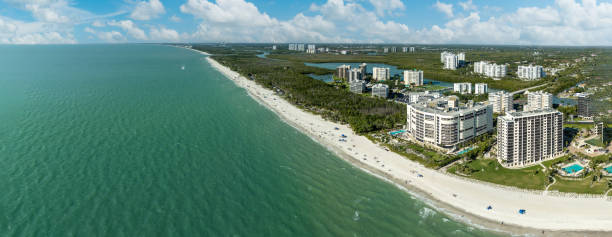 istock Blue sky over the beach along a Gulf Coast beach 2148769768