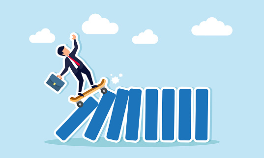 New disruptive innovation causing business upheaval, transforming and challenging existing competitors, concept of Innovative businessman swiftly skateboards, toppling all dominos in a cascade