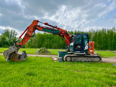 Mini crawler excavator for laying utilities on construction sites.