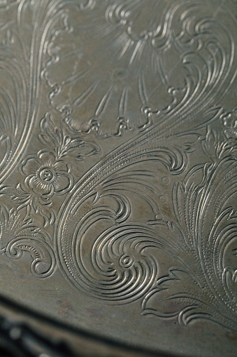 close up of elegant silver plated tray with scroll design