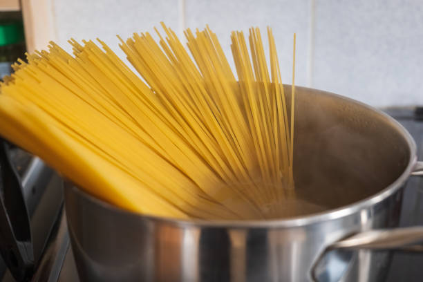istock Boiling spaghetti in pan on electric stove in the kitchen 2148772128