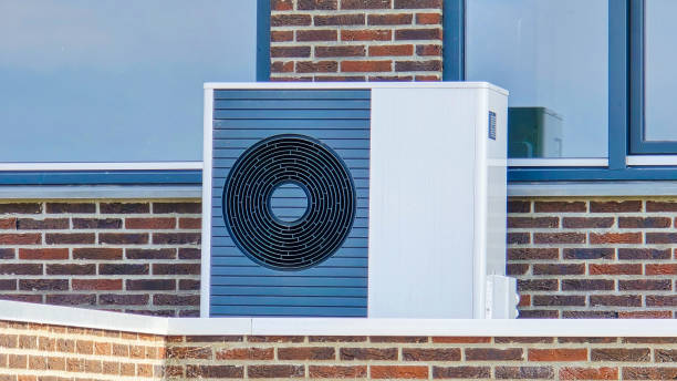 air source heat pump unit installed outdoors at a modern home with bricks in the Netherlands