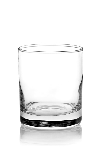 Empty small shot glass isolated on white background.