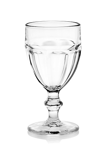 Glasses of whiskey and ice isolated on a white background