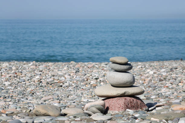 istock A pyramid of stones on a pebble beach. Close-up. Copy space 2148779839