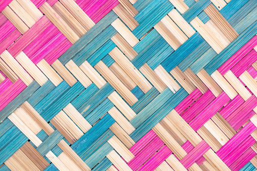 Wicker handmade fan background. Colorful bamboo weave.