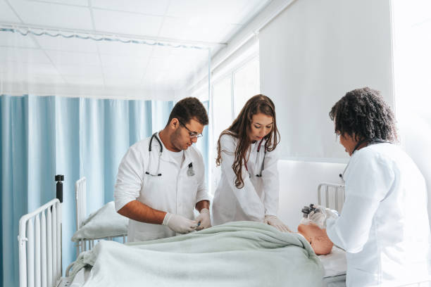 istock Medical students in a practical resuscitation class with a dummy in the ward 2148781587