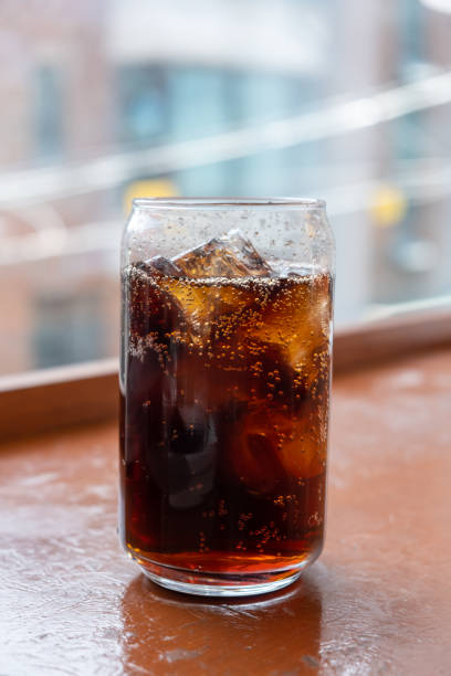 istock A can-shaped glass of Cola on the table with bokeh background 2148783097