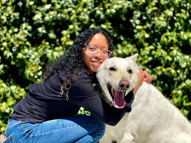istock Young Woman with her German Shepherd 2148784621