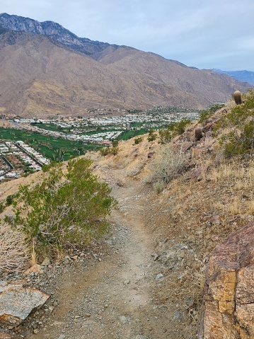 The trail offers views of the city and surrounding mountain ranges