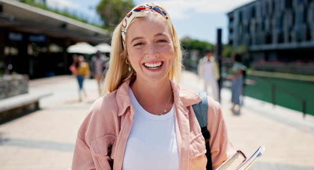 Student, woman and face at campus, outdoor and happy with books, backpack and pride for college education. Gen z person, girl and portrait with smile for learning, studying and progress at university