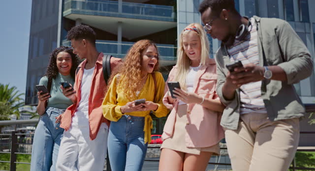 Friends, students and phone for texting at college, mobile app and share with post, meme or web blog. Gen z group, man and woman with smartphone, social media and funny chat at university in Atlanta