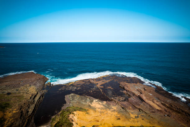 istock Scenic view of sea against clear blue sky-Red Point 2148786592