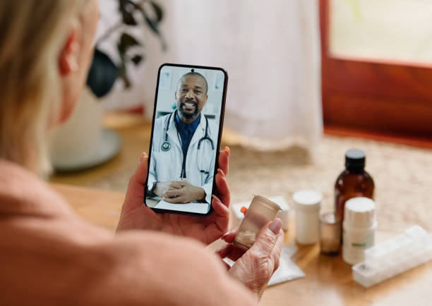 istock Person, telehealth and cellphone with medication or screen conversation for virtual prescription, advice or healthcare. Patient, man and internet communication for pill diagnosis, home or checkup 2148786849