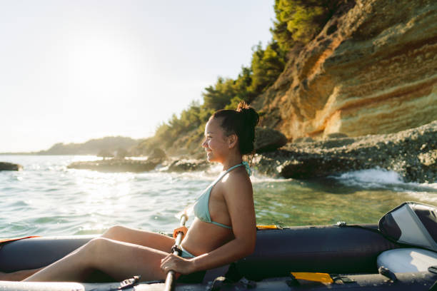 istock Young Asian girl kayaking at sunset 2148788587