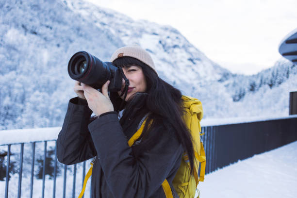 istock Outdoor Photographer Capturing Snowy Mountain Scenery 2148789207