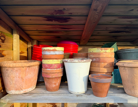 Assorted flower pots in a garden shed