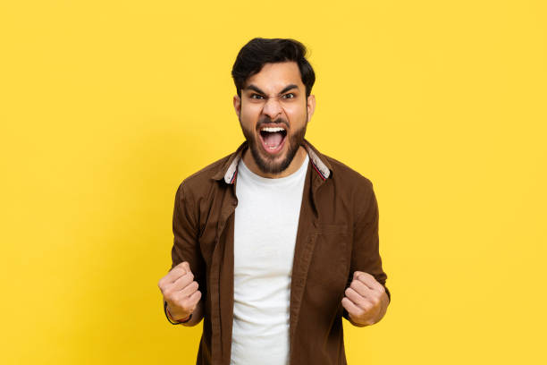 istock Excited Young Man Celebrating Success on Yellow Background 2148790086