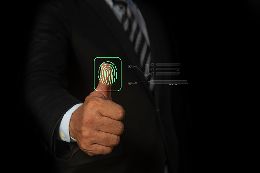 Businessman scan fingerprint biometric identity. Concept of the future of security and password control