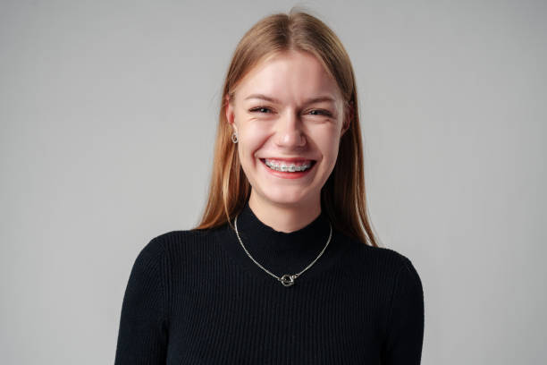 istock Smiling Woman in Black Top against gray background 2148791047