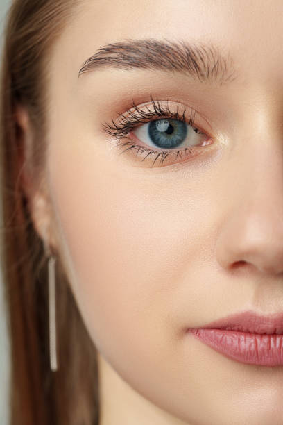 istock Close Up of Womans Face With Blue Eyes 2148792046