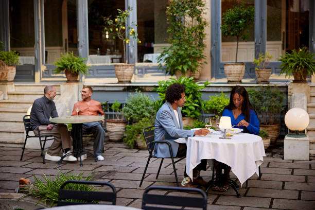 istock Relaxed couples eating and drinking outdoors 2148792914