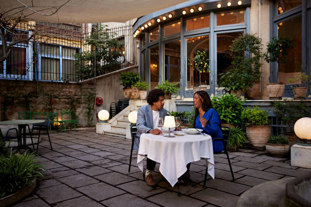 Couple enjoying early evening dinner date outdoors