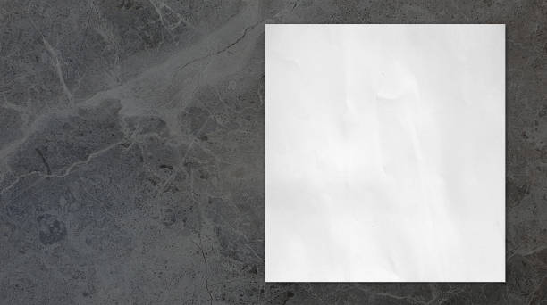 istock close up of white grunge paper placed on grey marble stone table with blank space for design. 2148793400