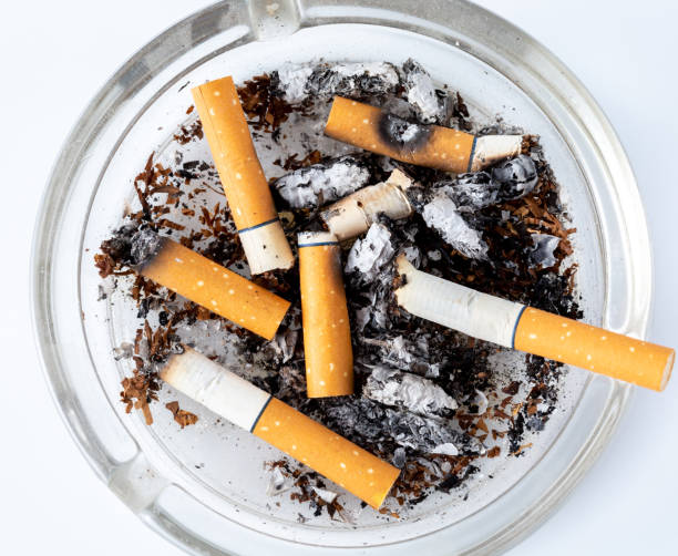 istock cigarettes in the ashtray on white background 2148793945