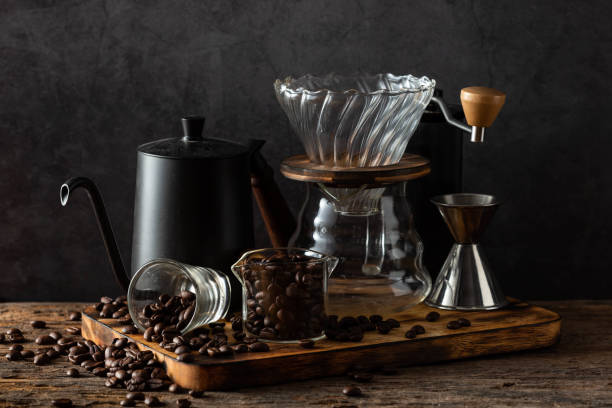 istock drip coffee with coffee beans on wooden table background 2148794100