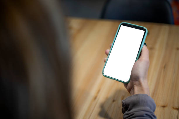 istock Woman holding cell phone in her hand 2148794546