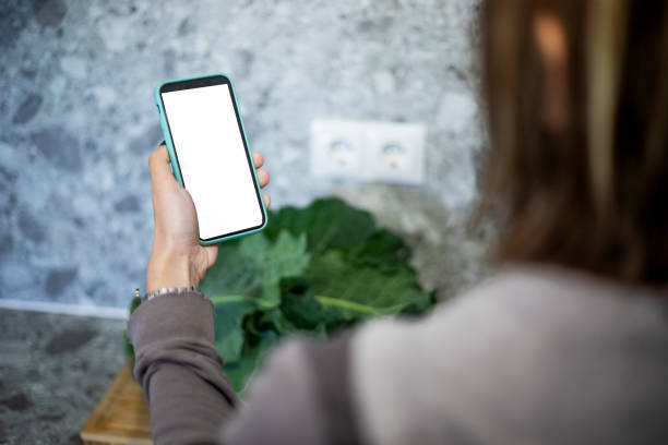 istock Woman holding cell phone in her hand 2148794631