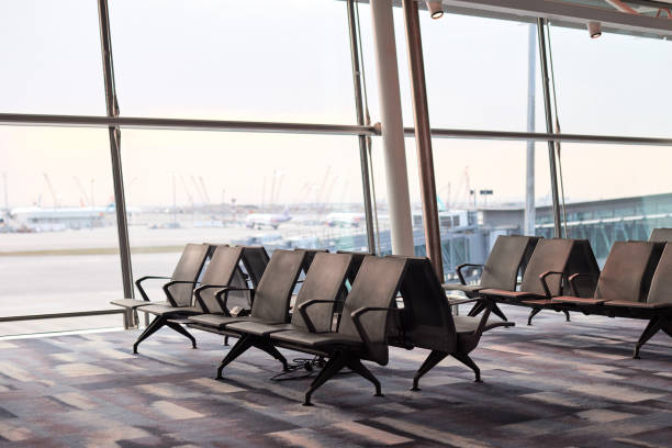 istock Row of empty chairs at airport waiting room 2148795103