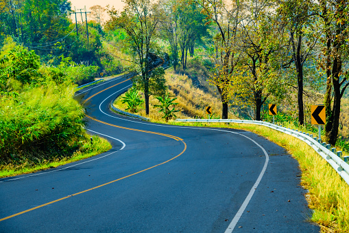 The winding and steep roads amidst the complex and beautiful mountains of Bo Kluea District in Nan Province, Thailand.
