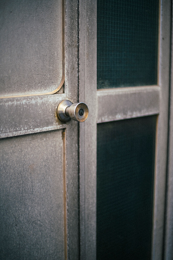 Doorknob of a dilapidated apartment