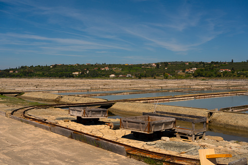 View of the salt evaporation ponds and boxes for transportating in Sicciole saltpans natural park
