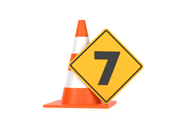 Traffic Cone And Traffic Sign With Number 7 On White Background