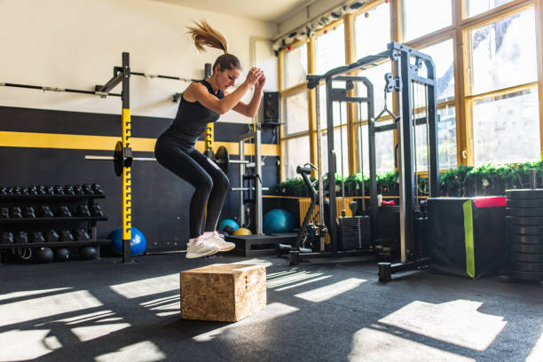 istock Woman exercising in gym 2148797904