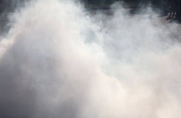 istock Smoke from under the wheels of the car. Background 2148797936